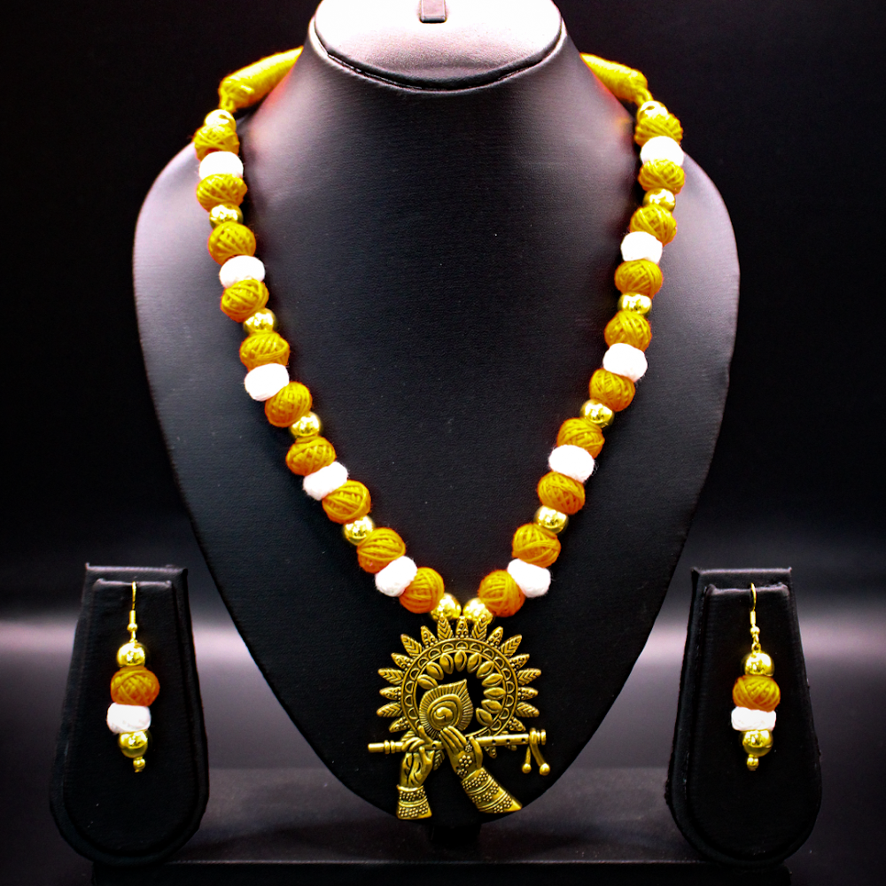 Surya Chakra Murli Orange Thread Jewellery Set