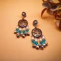 Mantra Engraved Oxidized Jhumka Earrings With White-Blue Beads