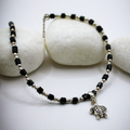 Dangling Tortoise Charm Silver-Black Beaded Anklets