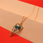 Resin Teal Flora Arrowhead Pendant
