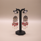 Mantra Engraved Oxidized Jhumka Earrings With Red Beads