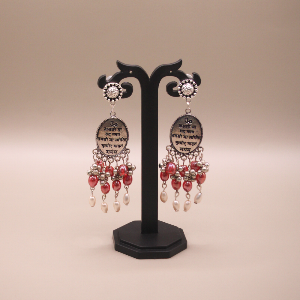 Mantra Engraved Oxidized Jhumka Earrings With Red Beads